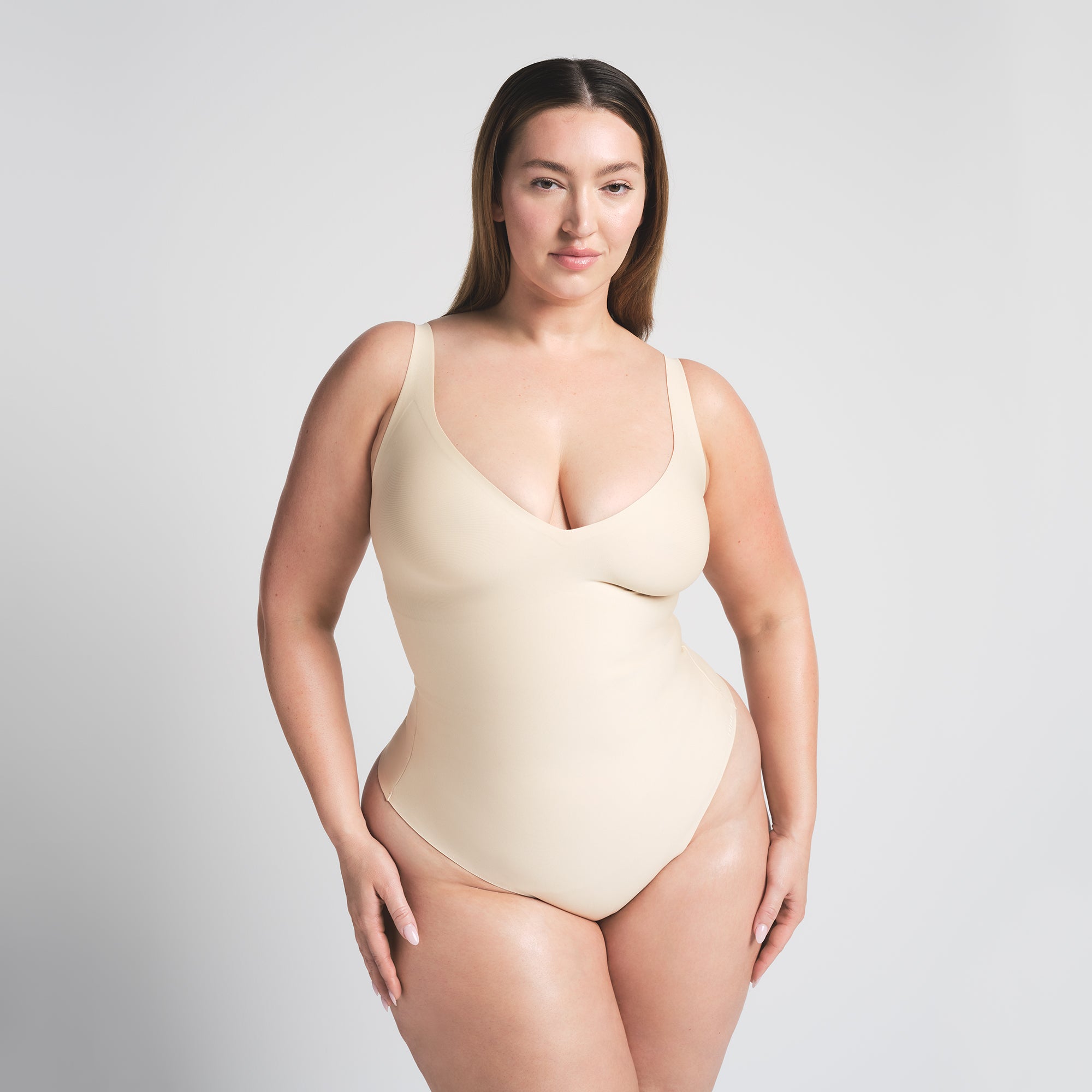 SKIMS BODY UNLINED PLUNGE THONG BODYSUIT | SAND - Image 2