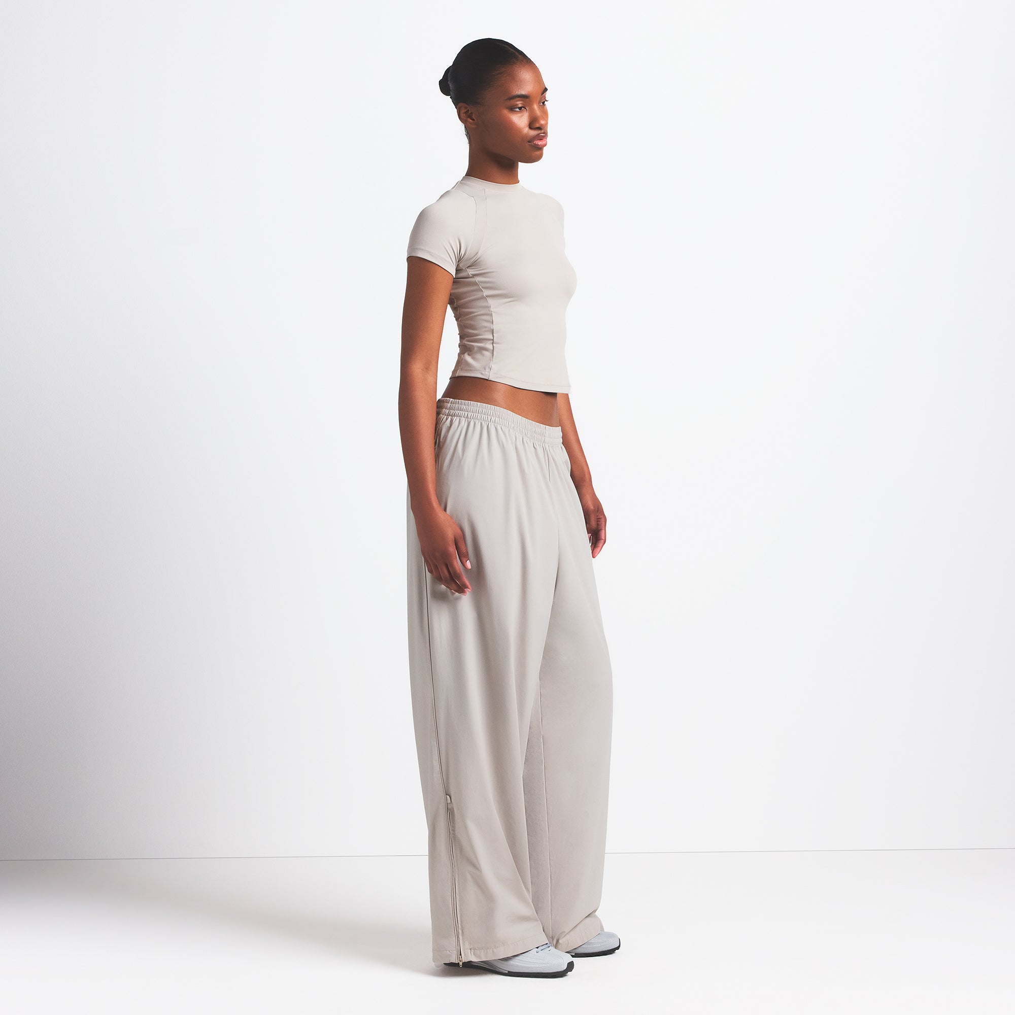 NikeSKIMS WOVEN NYLON OVERSIZED TRACK PANT | STONE - Image 3