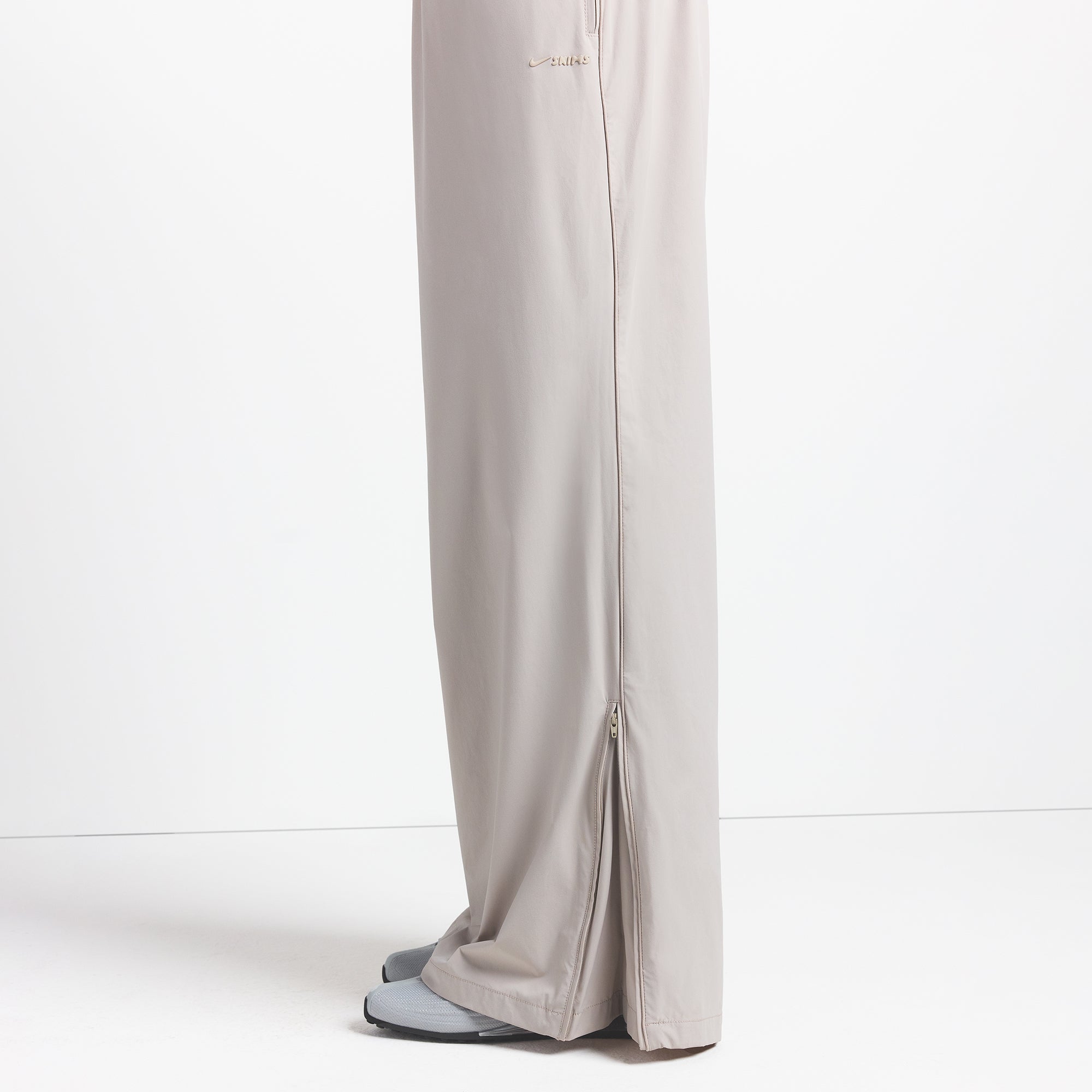 NikeSKIMS WOVEN NYLON OVERSIZED TRACK PANT | STONE - Image 4