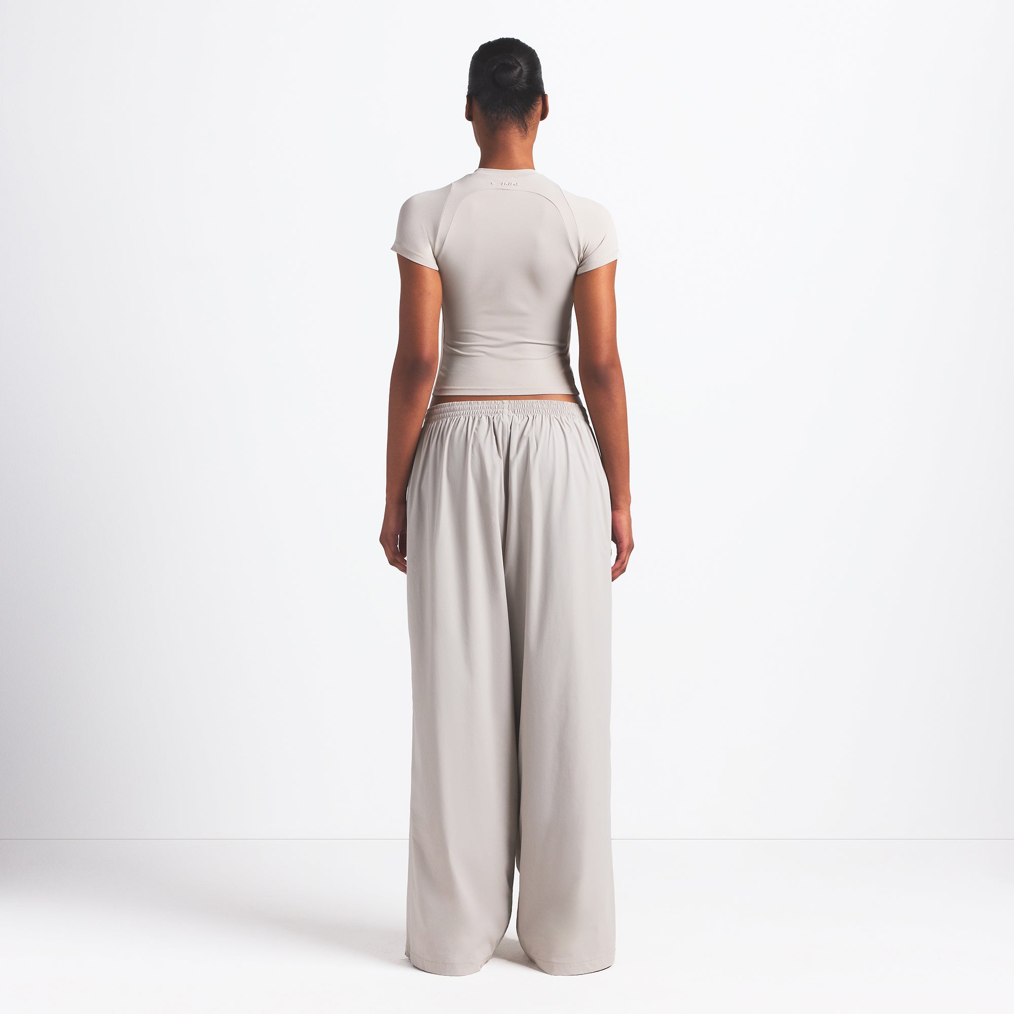 NikeSKIMS WOVEN NYLON OVERSIZED TRACK PANT | STONE - Image 5