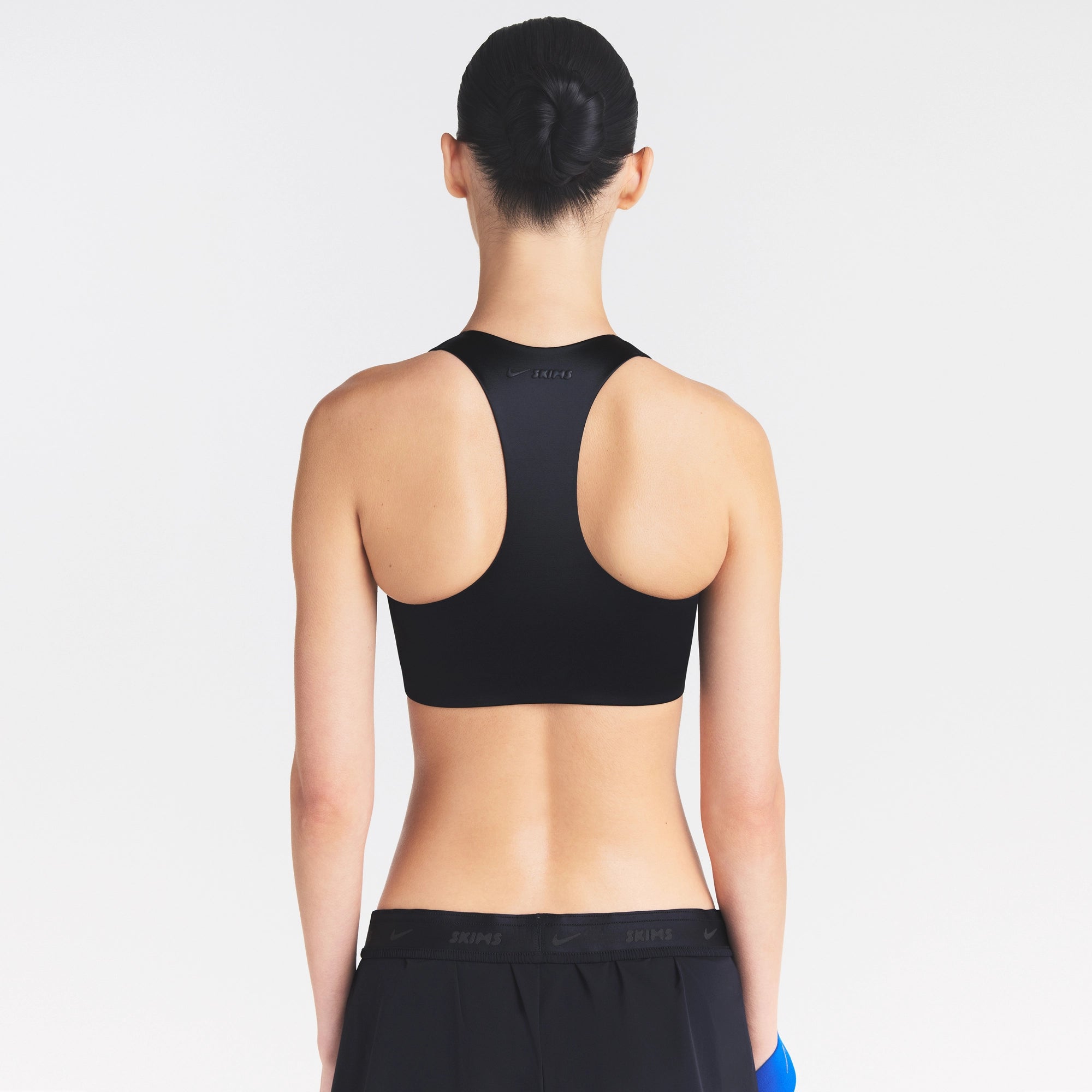 NikeSKIMS SATIN SHINE RACERBACK ZIP FRONT BRA | OBSIDIAN - Image 4