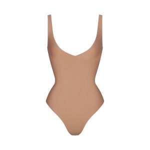 SKIMS BODY UNLINED PLUNGE THONG BODYSUIT | SIENNA