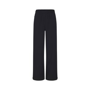 NikeSKIMS WOVEN NYLON OVERSIZED TRACK PANT | OBSIDIAN