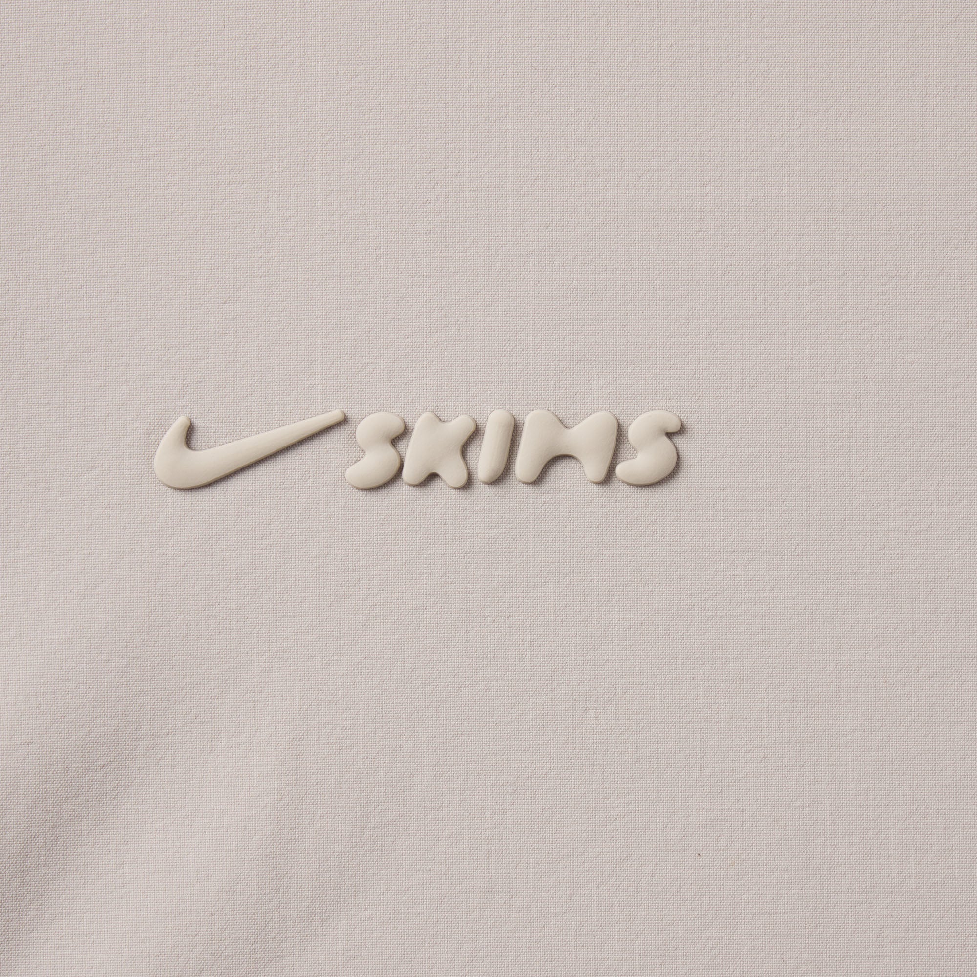 NikeSKIMS WOVEN NYLON OVERSIZED TRACK PANT | STONE - Image 6
