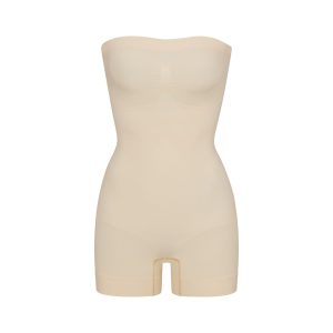 SEAMLESS SCULPT STRAPLESS SHORTIE BODYSUIT | SAND