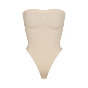 SEAMLESS SCULPT STRAPLESS THONG BODYSUIT | SAND